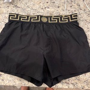 Men’s Versace swim trunks size 4 (equivalent to a medium) Black good condition